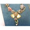 Image 2 : BOARD OF ORNATE NECKLACES AND BAG OF BEADED JEWELLERY