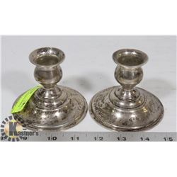 PAIR OF SILVER PLATED CANDLE STICK HOLDERS.