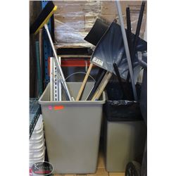 GARBAGE BIN FULL OF ASSORTED MOPS, BROOMS, SHOVEL
