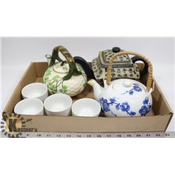 FLAT OF HANDMADE TEA KETTLES.