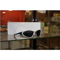 BOX OF BLUE AND SILVER OAKLEY STYLE SUNGLASSES