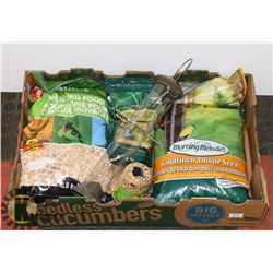 LARGE FLAT OF ASSORTED BIRD SEED AND FEEDER.