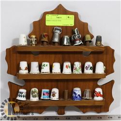 COLLECTION OF 23 THIMBLES ON DISPLAY PLAQUE.