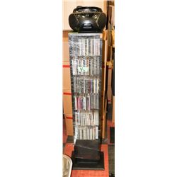 LARGE RACK OF CDS WITH PORTABLE CD PLAYER