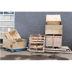 STACK OF WOOD CRATES AND LARGE PALLETS