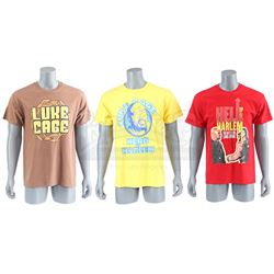Lot # 654: Three Luke Cage Novelty Shirts