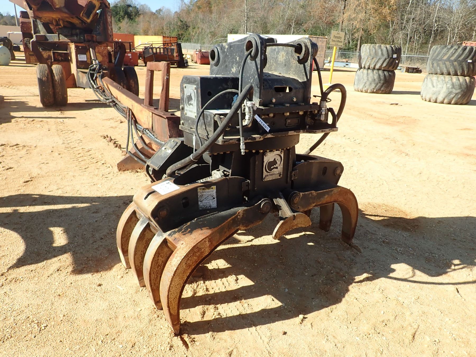 ROTOBEC ROTATING GRAPPLE W/SAW (A3) J.M. Wood Auction Company, Inc.