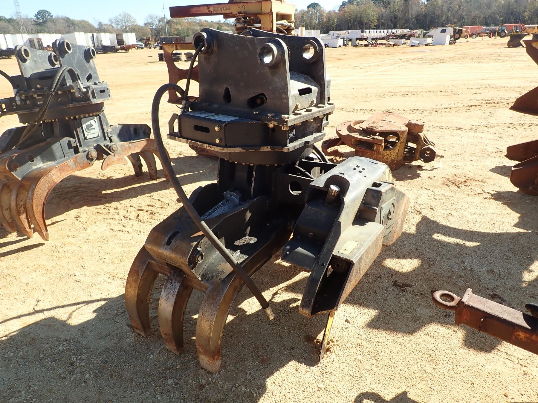 ROTOBEC ROTATING GRAPPLE W/SAW (A3) J.M. Wood Auction Company, Inc.