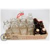 Image 1 : BOX OF VINTAGE MILK BOTTLES/JARS.