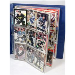 BOOK OF ASSORTED HOCKEY CARDS.