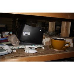 LARGE SHELF OF HOME ITEMS INCLUDING IRONS, IRON BOARD, STEAMER, MOP BUCKET AND LARGE COFFEE CUP