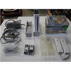 NINTENDO WII WITH 8 GAMES AND ACCESSORIES