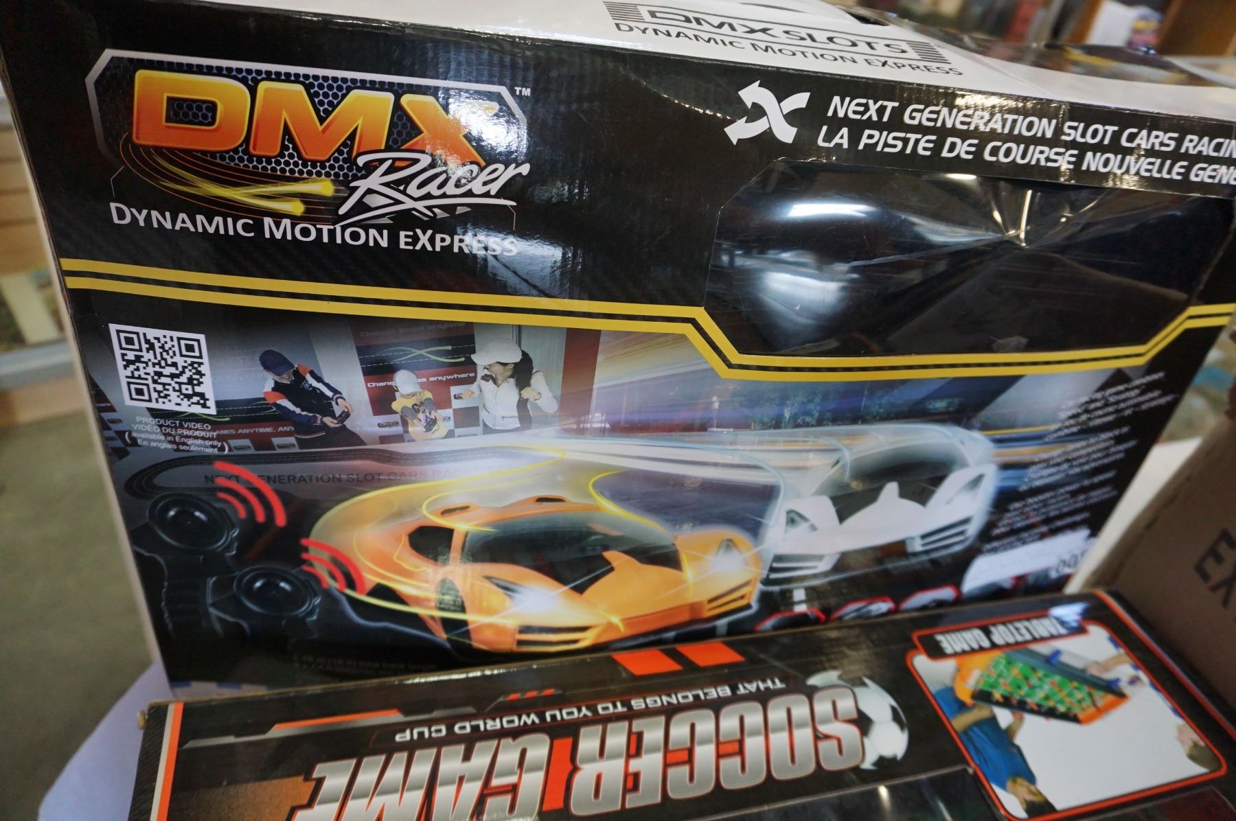 DMX RACER SLOT CAR SET, 3 HELMETS, AND MINI FOOSBALL GAME