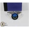 Image 1 : BLUE FACED SWAROVSKI LADIES WATCH WATER RESISTANT.
