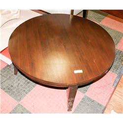 BOUTIQUE ROUND WOOD TONE COFFEE TABLE.