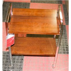 BOUTIQUE CHROME AND WOOD TONE END TABLE ON WHEELS