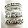 Image 1 : FOUR SHINY STERLING RINGS SIZES 5-8
