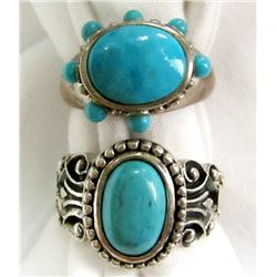 2 TURQUOISE COLORED SILVER RINGS