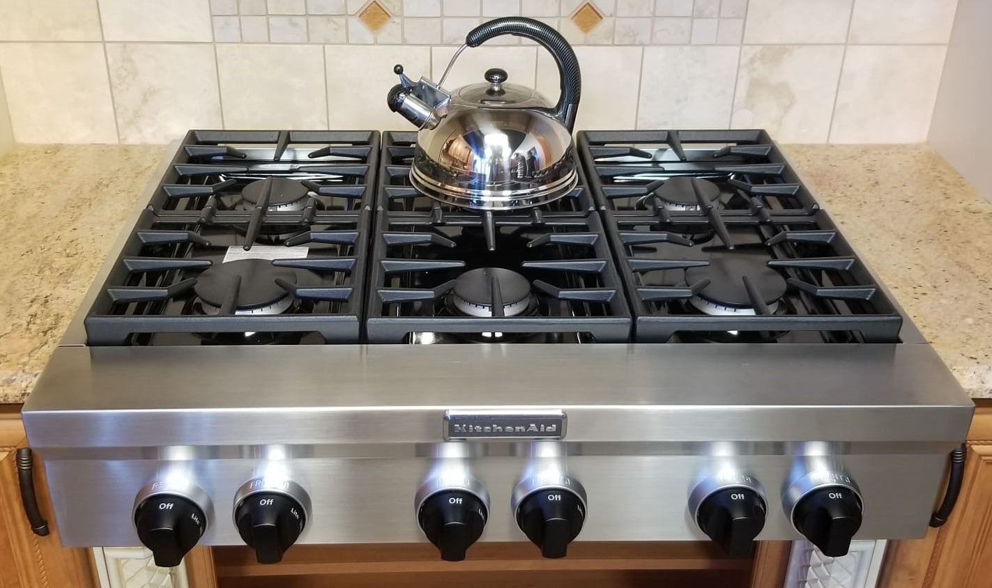 KITCHEN AID 6 BURNER STAINLESS STEEL STOVE.