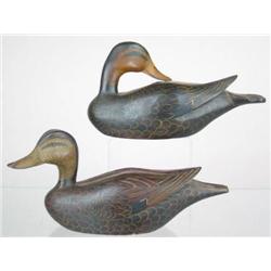 Lot of two half sized black ducks with carved win