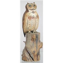 Standing great horned owl carving mounted on a se