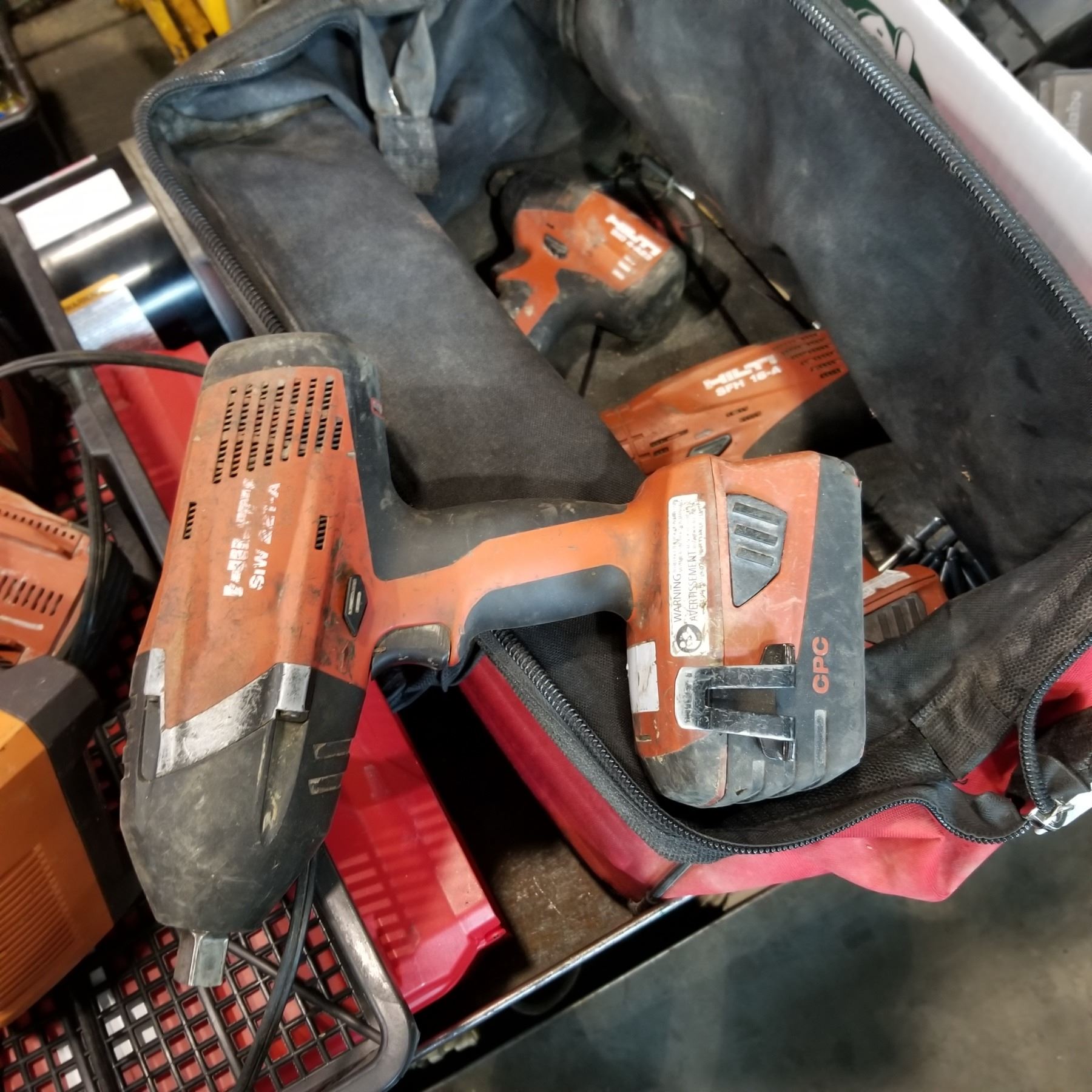 HILTI BAG HALF INCH IMPACT WRENCH 2 DRILLS AND 2 BATTERIES Big Hilti bag half inch impact wrench 2 drills and 2 batteries big