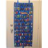 Image 1 : OVER 100 MATCHBOX CARS ON DOOR MOUNT RACK WITH SLEEVES