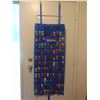 Image 2 : OVER 100 MATCHBOX CARS ON DOOR MOUNT RACK WITH SLEEVES