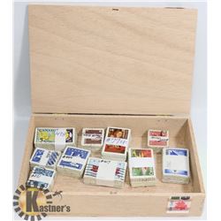 CIGAR BOX WITH 10X100 BUNDLED & CATALOGUED STAMPS.