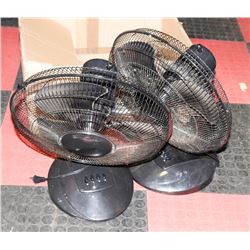 A PAIR OF BLACK ROTATING TABLE FANS