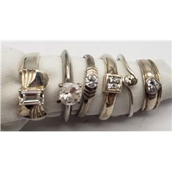 6-STERLING RINGS WITH CLEAR CENTER STONES