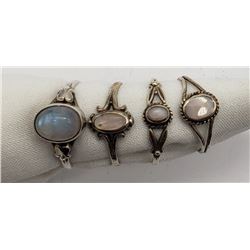 4-STERLING RINGS WITH LIGHT BLUE AND WHITE