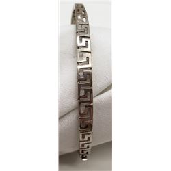 STERLING BANGLE WITH CLASP ENCLOSURE.