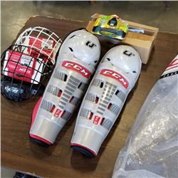 LOT OF NEW ICE HOCKEY SHIN PADS, HELMET CAGES AND GORILLA SKATE LACES