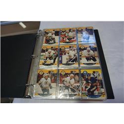 BLACK BINDER OF SPORTS CARDS