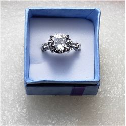 9)  SILVER TONE WHITE TOPAZ SOLITAIRE