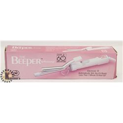 THE BEEPER CURLING IRON.