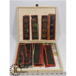 LARGE ASSORTMENT OF GLASS AMUSEMENT SLIDES.