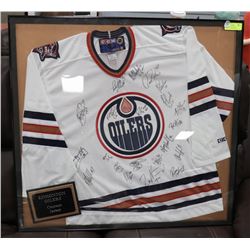TEAM SIGNED & FRAMED EDMONTON OILERS JERSEY.