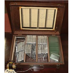 WOODEN BOX OF VINTAGE GLASS SLIDES & FRAMES.