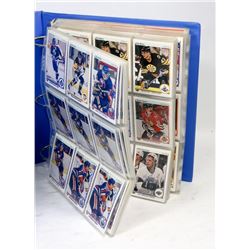 LARGE BINDER OF MIXED YEAR HOCKEY CARDS.
