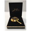 Image 1 : SALVADOR DALI GOLD LENS IN JEWELRY BOX USED FOR LINCOLN DALIVISION