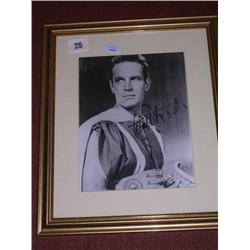 Charlton Heston signed B/W photo framed and glazed.