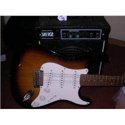 A Squiers Strat electric guitar with cover + x12 Realistic amplifier