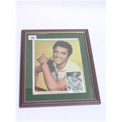 Framed coloured print of Elvis Presley with a black and white card with Elvis mark.