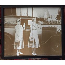 Blown Up Photo of Coca Cola Workers Standing in Front of a Coca Cola Truck in Uniform