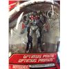 Image 2 : 3 Miscellaneous New in Package Figures. Marvel Spiderman, Optimus Prime Key Chain, and Summer Slam S