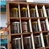 Image 5 : WOOD HARDWARE ORGANIZER FULL OF JARS OF HARDWARE AND RED TOTE OF HARDWARE