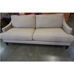 TAN UPHOLSTERED PILLOW BACK SOFA