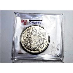 11)  CANADIAN 1957 50 CENT COIN